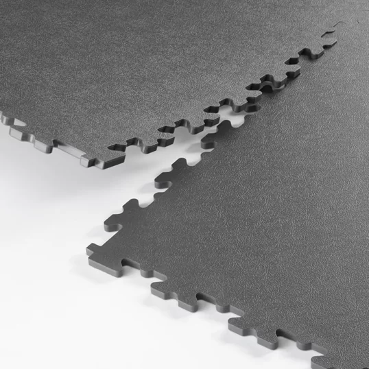 Close up showing Ecotile's ESD interlocking tiles connecting together and showing the interlocking joints