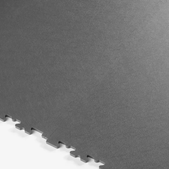 Image showing two interlocking ESD floor tiles connected together on a flat surface, showing the connecting X-joint mechanism
